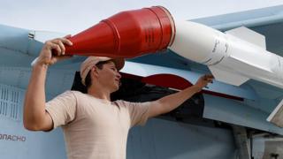 A Russian air force technician preparing a warplane for a mission at a base outside Latakia, Syria
