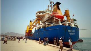 A ship carrying food aid for the UN"s World Food Programme (WFP) docks at the southern port of Aden, Yemen, 21 July 2015.