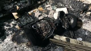 The family were gathered in the living room of the house when the hoverboard "burst into flames"