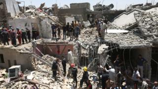 Iraqi security forces search for survivors after a bombing attack in the eastern neighbourhood of New Baghdad. Iraq, 6 July 2015