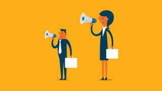 Businessman and businesswoman with a loudspeaker