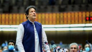 Pakistan's Prime Minister Imran Khan (L) speaks during the National Assembly session in Islamabad.