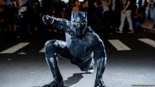 A fan cosplays as Black Panther from the Marvel Universe during the 2018 New York Comic-Con.
