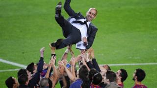FC Barcelona players throw Josep Guardiola their head coach into the air at the end of the La Liga match between FC Barcelona and RCD Espanyol at Camp Nou 5 May 2012