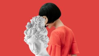 Woman and statue