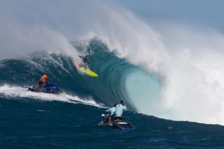 Hawaiian surfer Paige Alms surfs a big wave at Jaws, off the coast of the Maui Island in Hawaii to win the Peahi Challenge 2016, on November 11, 2016, the first-ever Women's Big Wave Tour event.