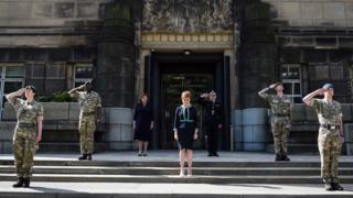 First Minister Nicola Sturgeon marks the VE Day two-minute silence outside St Andrew's House on May 8, 2020 in Edinburgh