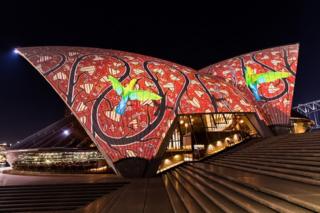 An Indigenous light display projected on to the Sydney Opera House