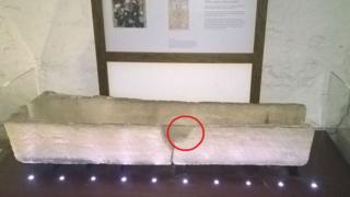 Damaged coffin