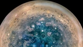 South Pole: The polar cloud structure at Jupiter is very different from that at Saturn