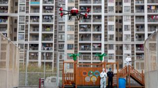 flying a drone over a kids park