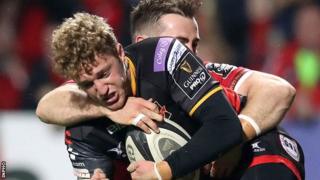 Dragons' Angus O'Brien is tackled by JJ Hanrahan of Munster
