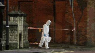 A forensic officer at the scene in Coleraine where two women were stabbed