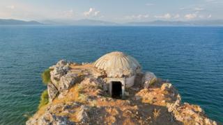 A bunker on a cliff next to the sea in Albania