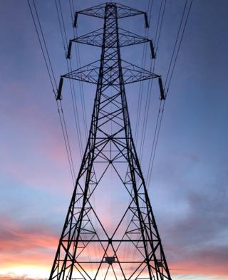 An electricity pylon at sunset