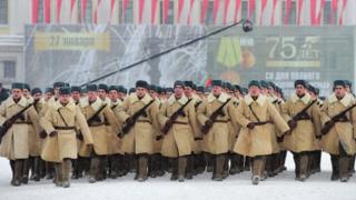 Soldiers dressed in Soviet WW2 uniforms march in St Petersburg. Photo: 27 January 2019