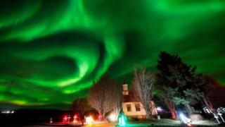The northern lights over Villingaholtskirkja Church