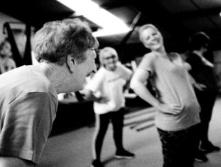 Members of the sport class laugh together.