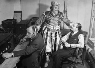 Picture shows an outside broadcast from the Drury Lane Theatre of Jack and the Beanstalk. (l-r) an engineer with gear, Clifford hatherley and John Watt.