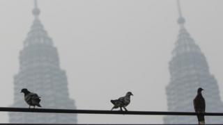Malaysia's Petronas Twin Towers engulfed in smoke