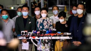 Tanya Chan (C) and other pro-democracy lawmakers gather at Legco