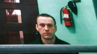 Russian opposition figure Alexei Navalny is seen on a screen via a video link from his penal colony during a hearing about his right to correspond while in jail, at the Russian Supreme court in Moscow, Russia, 22 June 2023