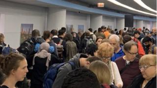 Passengers waiting at O'Hare airport