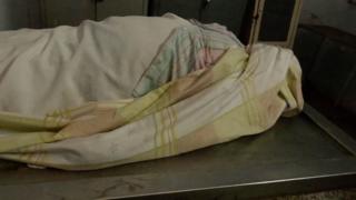 Мертвое тело в морге, страдающее от перебоев в подаче электроэнергии и отсутствия структуры в Венесуэле