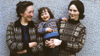 Two women and a young girl pose wearing Fair Isle sweaters in Lerwick, Shetland Islands in 1970.