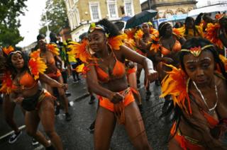 Performers take part in the Notting Hill Carnival family day.