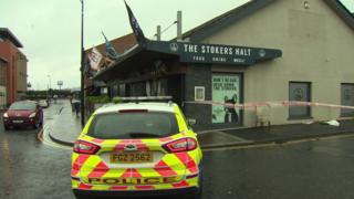 A police car at the scene of the attack outside the Stoker's Halt bar