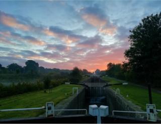 Sunrise over canal docks