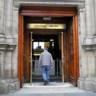 Man walking into Central Library in Edinburgh