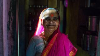 Ramabhai Ganpat smiling in a pink sari