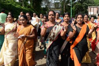 Hindu devotees and activists shout slogans praising the Hindu god Ayyapa at a protest against the Supreme Court verdict revoking the ban on women entering Sabarimala temple.