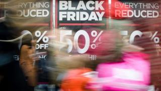 Retail stores display 'Black Friday' advertisements and banners on Oxford Street in central London