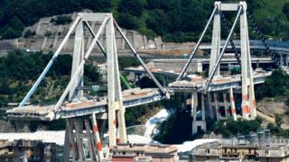 The remaining towers of Genoa's Morandi motorway bridge that are to be destroyed with explosives, seen in red on the concrete structure below, 27 June 2019