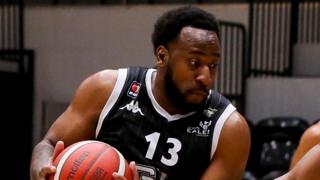 Darius Defoe, wearing number 13, playing basketball for Newcastle Eagles 