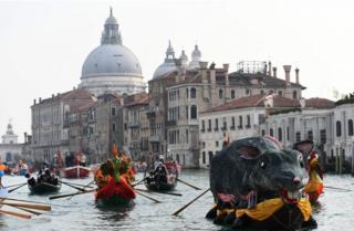 The "Pantegana" (Big Rat) sails on the Grand Canal with other decorated boats for the traditional regatta which officially opens the Carnival in Venice