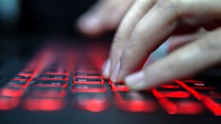 Fingers typing on a computer keyboard