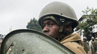 Kenyan police officer in Kibera slum
