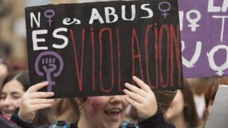 A student holds a banner that reads "It is not abuse, it is rape" in a protest in Vitoria, northern Spain, 10 May 2018