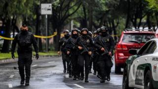 Police officers are deployed after Mexico City's Public Security Secretary Omar Garcia Harfuch was wounded in an attack in Mexico City, on June 26, 2020.