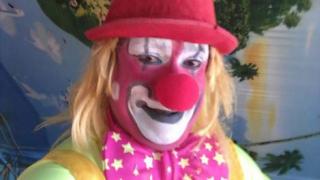 Clown poses for a selfie