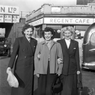 Three women looking at the camera