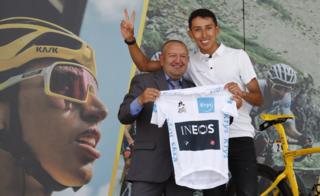 Colombian cyclist Egan Bernal, winner of the Tour de France 2019, poses with his first coach Fabio Rodriguez (L) during a tribute celebrated at his hometown, Zipaquira, in Cundinamarca, Colombia