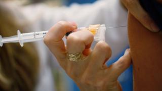 A paediatrician administers a vaccine in Florida, US