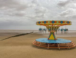 A merry-go-round on a beach