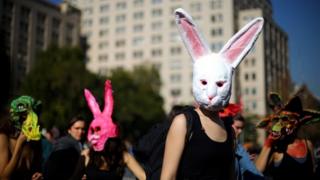 Demonstrators wear masks during a march demanding an end to sexism and gender violence in Santiago, Chile June 6, 2018.