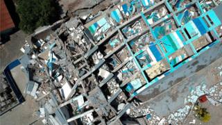 This aerial picture shows the remains of a ten-storey hotel in Palu in Indonesia"s Central Sulawesi on September 30, 2018 after it collapsed following a strong earthquake in the area.